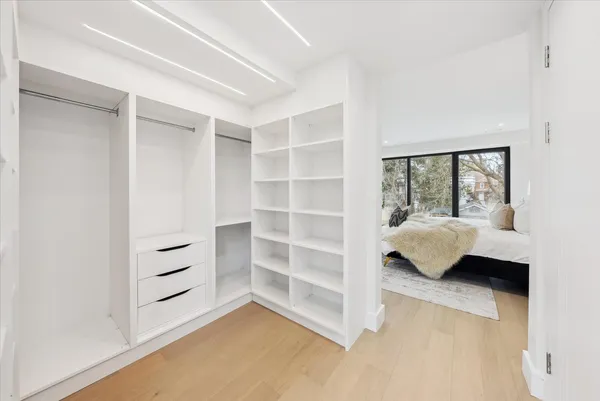 Custom walk-in closet with integrated lighting