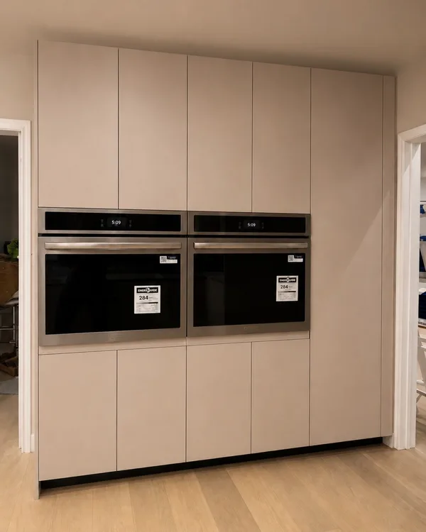 Full-height appliance wall with integrated double ovens in Hamilton kitchen