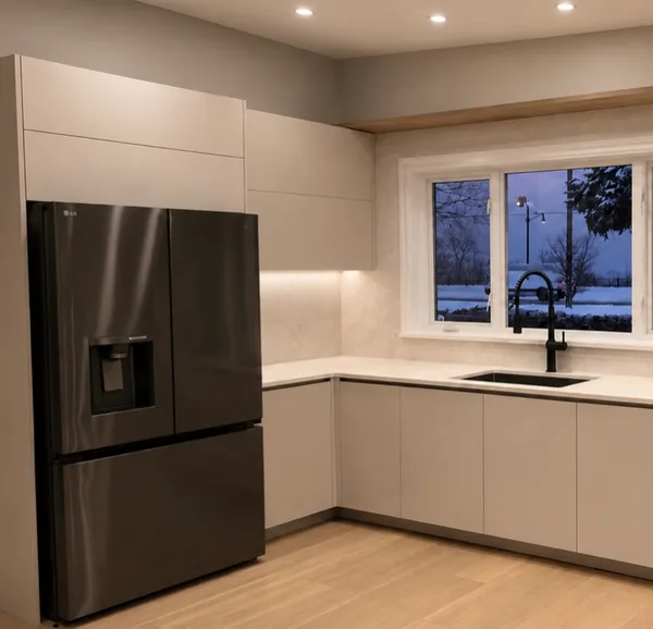 Hamilton kitchen with integrated refrigerator and neutral slab cabinetry