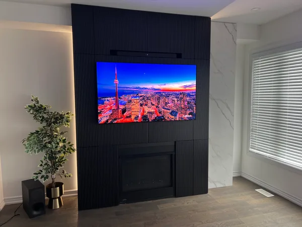 Fluted cabinetry media wall hidden storage Niagara Falls