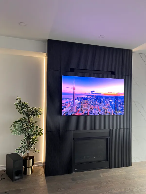 Stone-inspired MDF panels LED lighting media wall