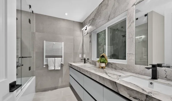 Forest Hill bathroom vanity with stone wall surround and double sink