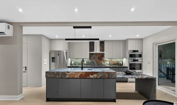 Forest Hill kitchen with stone island and integrated appliance wall
