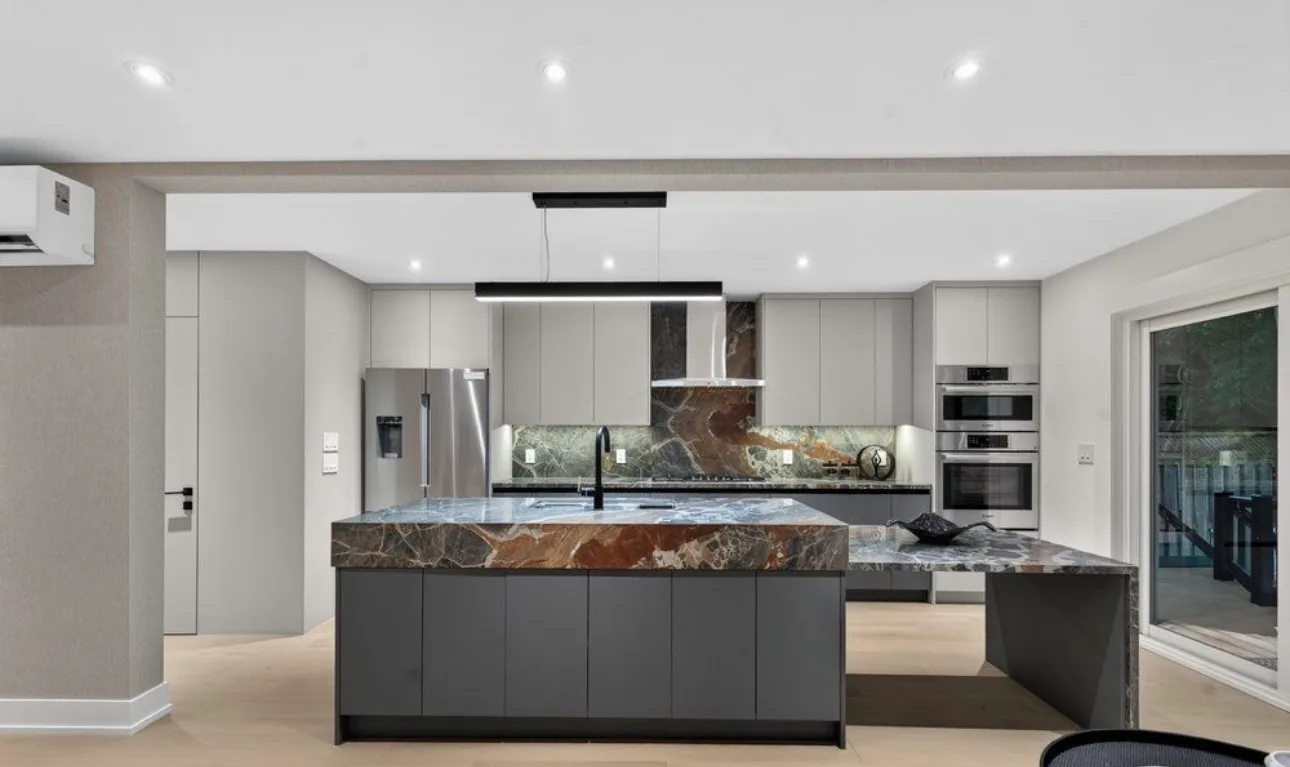 B3 Interiors whole-home cabinetry project with coordinated kitchen and living millwork