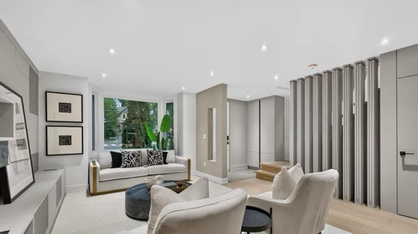 Forest Hill living room with stair panel detail and custom storage